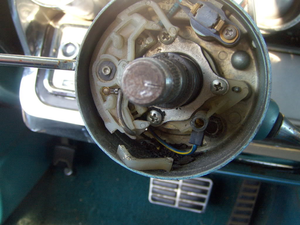 Getting the wheel off reveals the turn signal mechanism. The canceling prong for one direction was broken off and lying in the column.