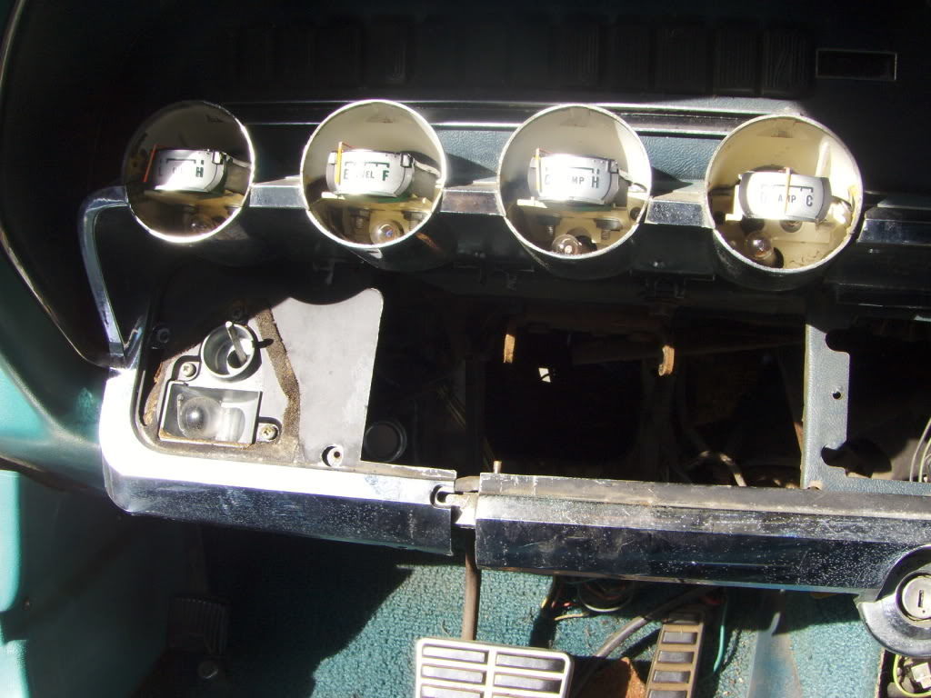 I only needed to remove the trim panel, lower fascia pieces and the radio access cover. The gauge bezels are off, but didn't need to be. The swing away doors came off with the removal of two small bolts and a center clip.